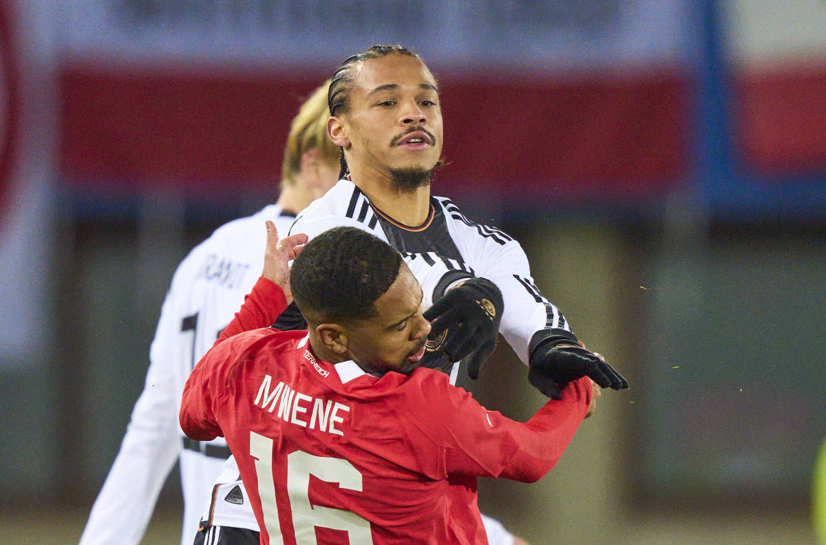 Leroy Sane pictured shoving Phillipp Mwene in the face during Germany's 2-0 loss to Austria in November 2023